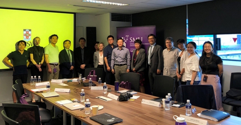 CIBELers at SMU with Associate Dean (Faculty Matters & Research) Professor Gary Chan (L5), Associate Professor Henry Gao (R4), Associate Professor Pasha Hsieh (R7) and participants of the mini-symposium.