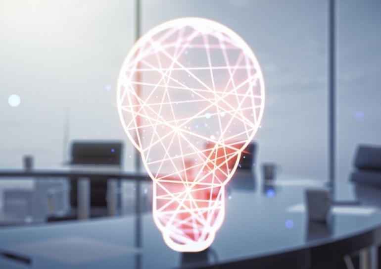 A computer representation of a lightbulb on a desk in an office building