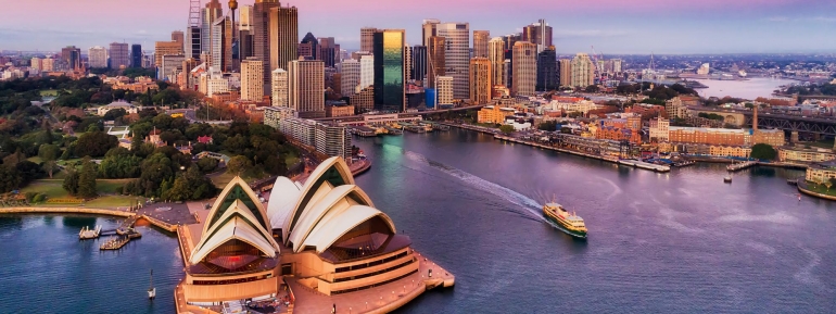 image of sydney opera house and city at dawn