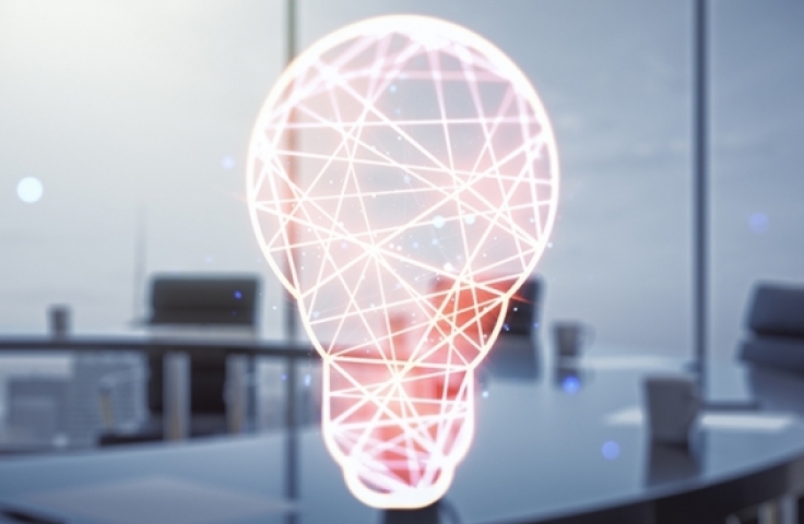 A computer representation of a lightbulb on a desk in an office building
