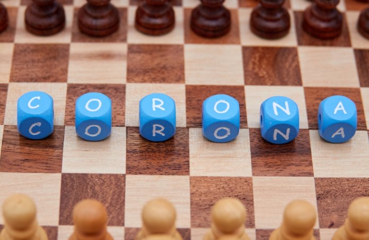 Corona spelled out on chess board 