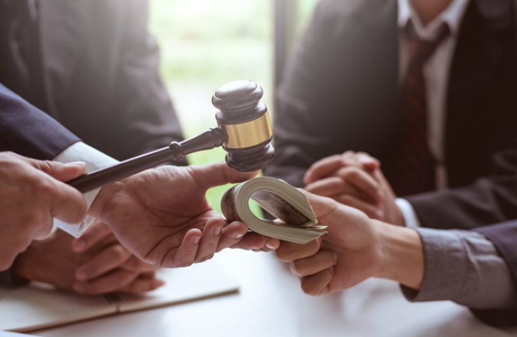 Gavel amongst men in suits 