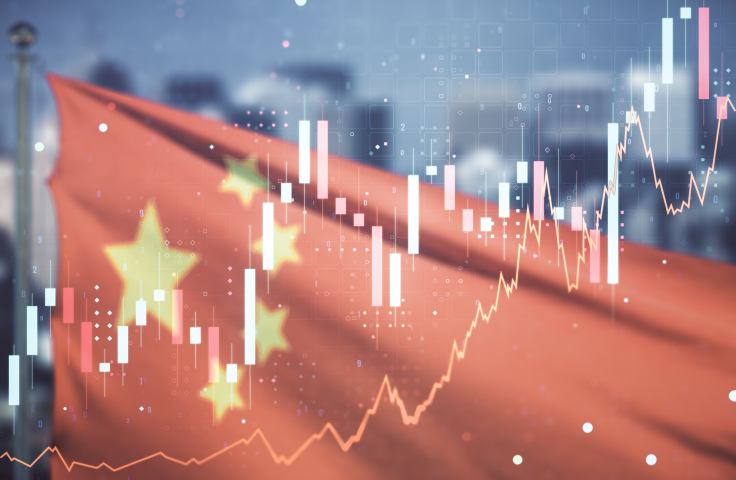 Abstract virtual financial graph hologram on Chinese flag and skyline background, financial and trading concept. Multiexposure