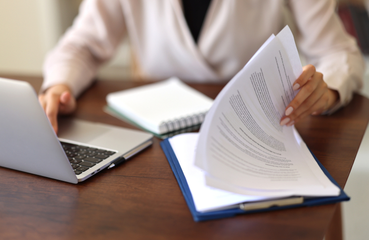 Cropped shot of an unrecognisable businesswoman sitting alone and using her laptop while working from home stock photo